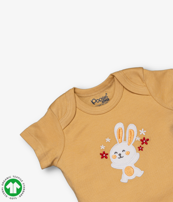 Girls Short sleeve bodysuit in young wheat color with rabbit embroidery, envelope neck design and snap crotch